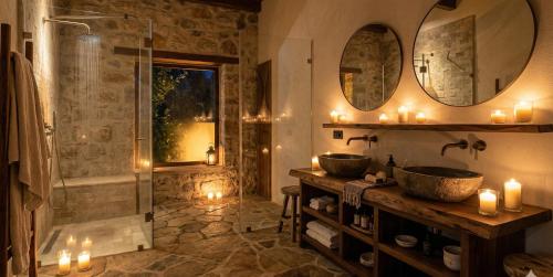 a bathroom with two sinks and a shower with candles at Zefir Apart in Ordu