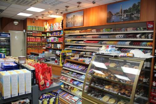 a store filled with lots of different types of food at Hotel Restaurant Old Bridge in Amsterdam