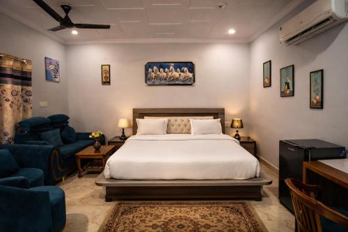 a bedroom with a bed and a living room at The Asanar Hills in Rūpnagar