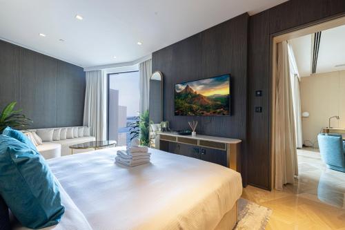 a bedroom with a large bed in a room at FIVE Palm Luxury 1BR Apartment with Stunning Views in Dubai