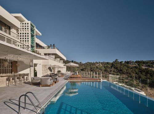 a swimming pool on the side of a building at WAM by Karma in Bodrum City