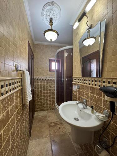 a bathroom with a sink and a mirror at Casa Roma Boutique Hotel in Bodrum City