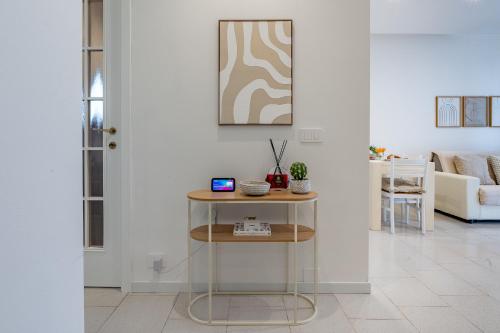 a living room with a table and a couch at Maison di Andrea in Zibido San Giacomo