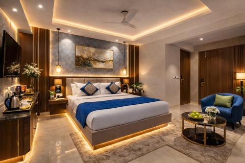 a hotel room with a bed and a chair at Velocity Corporate Hotel TERMINAL 2,3 Delhi Airport With- Free Airport Pickup in New Delhi