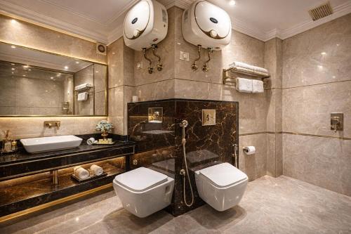 a bathroom with a toilet and a sink and a mirror at Velocity Corporate Hotel TERMINAL 2,3 Delhi Airport With- Free Airport Pickup in New Delhi