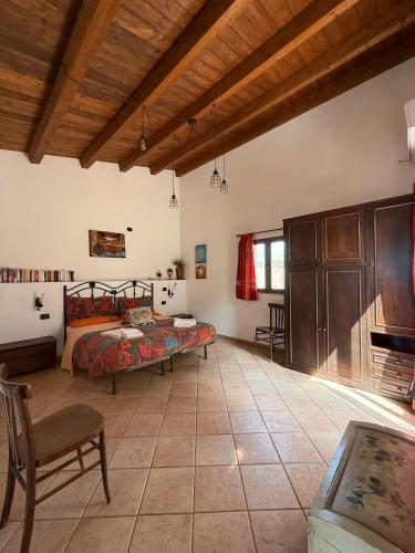 a large room with a bed and a table at Terrazza delle mura in Cefalù