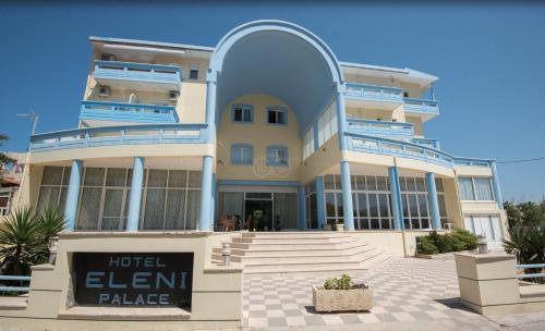 a large building with a sign in front of it at Eleni Palace in Amoudara Herakliou