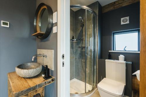 a bathroom with a sink and a shower at Apres Ski in Ilkley