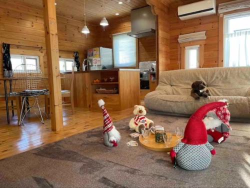 a group of stuffed animals sitting in a living room at Private house LOG HOUSE 瀬戸市品野町 #AB1 in Seto