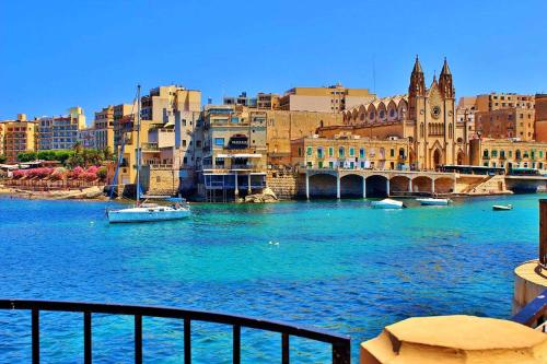 a view of a river with buildings and a city at Apartment with Stunning Seaviews in Sliema