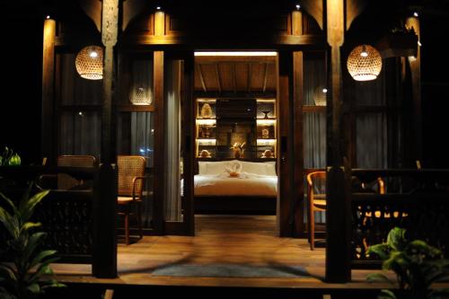 a bedroom with a bed in a room at Uma Cabins by Uma Experience in Penginyahan