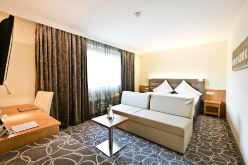 Cama ou camas em um quarto em Stadthotel Goldenes Schiff