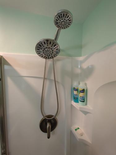 a shower with two shower heads in a bathroom at Private White Mountains Guest Suite - Welcome! in Littleton