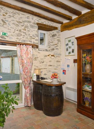 a room with a large wooden barrel in a building at Domaine de la Cour in Sainte-Gemme-dʼAndigné