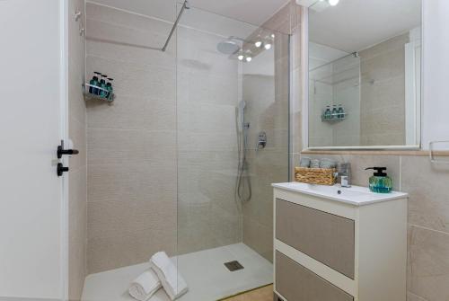 a bathroom with a shower and a sink at YourHouse Llimonera in Port de Pollensa