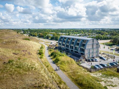 an aerial view of a building on a hill at Residence Westduin in Sint Maartensvlotbrug