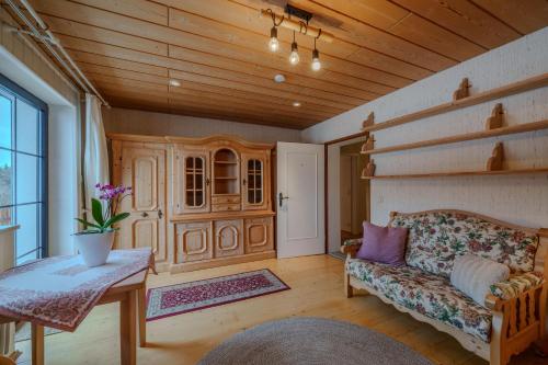 a living room with a couch and a table at Adlerhorst in Bad Wörishofen