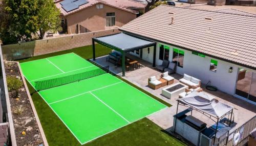an overhead view of a tennis court in front of a house at Desert Escape - Private Pool - Spa in Indio