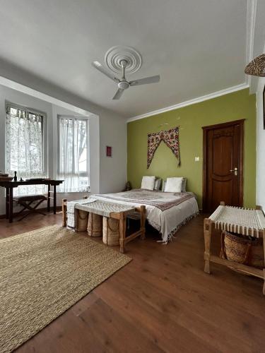 a bedroom with a bed and a piano in it at Samadhi House in Burhānilkantha