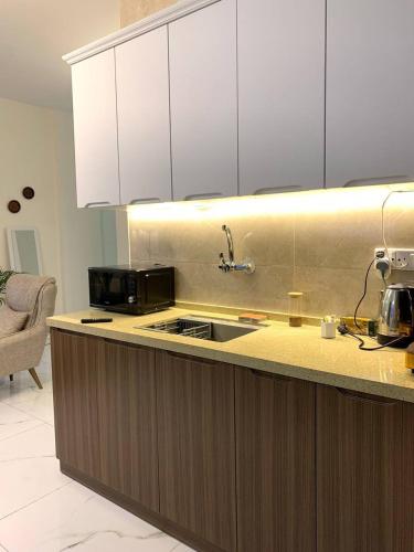 Cuina o zona de cuina de Carmel Residence - كارمل ريزيدنس