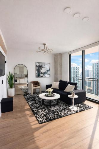 a living room with a couch and a table at Prime Miami location - Modern Skyline Stay in Miami
