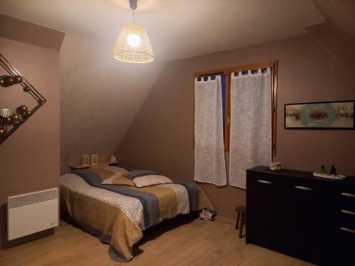 Llit o llits en una habitació de Le Grand Orient