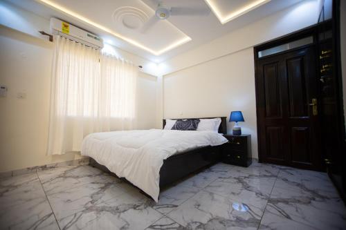 Llit o llits en una habitació de Winners Home