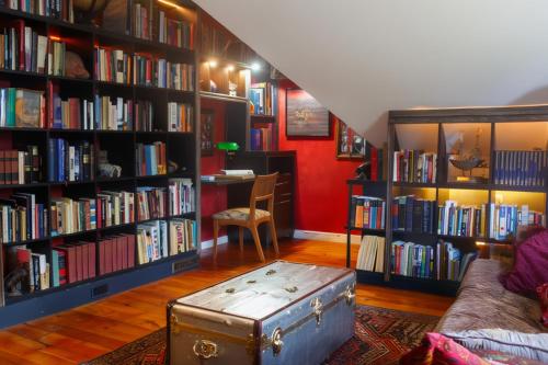 a room with bookshelves filled with books at Cooperstown Bed and Breakfast in Cooperstown