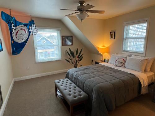 a bedroom with a bed with a flag on the wall at Sexy Suite in Cedarburg