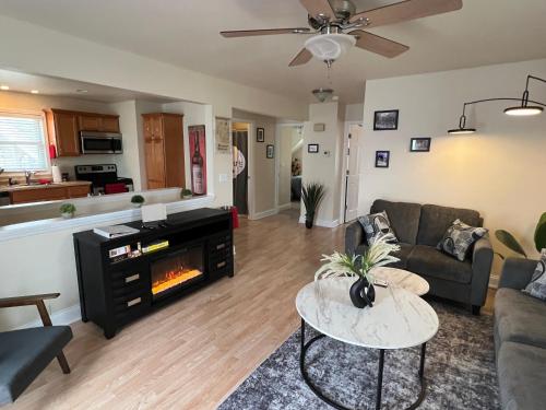 a living room with a couch and a fireplace at Sexy Suite in Cedarburg