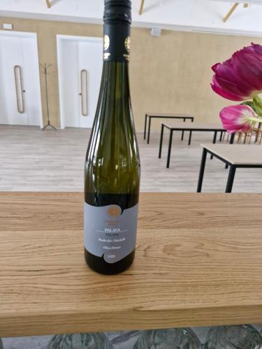 a bottle of wine sitting on top of a table at Ubytování Hilšer in Potštát