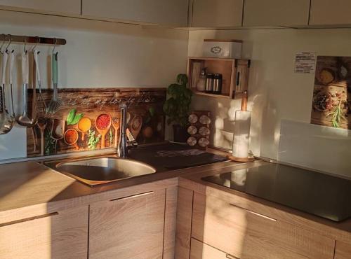 a kitchen with a sink and a counter top at Mobile Home Annika Mar in Selce