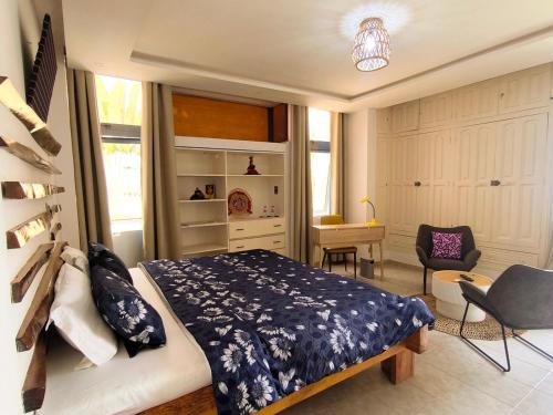 Llit o llits en una habitació de Résidence Villa Rosa