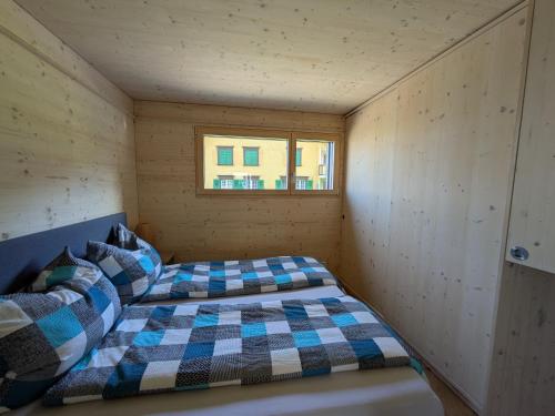 เตียงในห้องที่ TinyHouse - (D)ein Ferienhaus