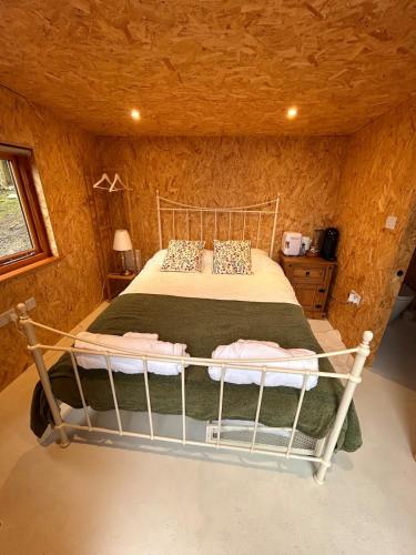 a bedroom with a bed in a room at Bijou Cabin in Ludlow