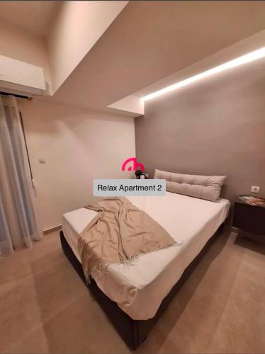 เตียงในห้องที่ Relax Apartment 2