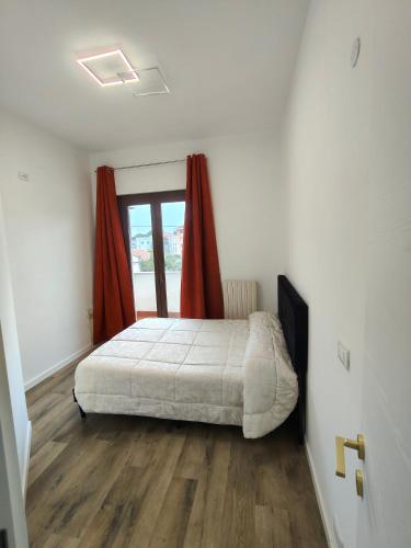 a bedroom with a bed and a window at Suite il Sogno in Francavilla al Mare
