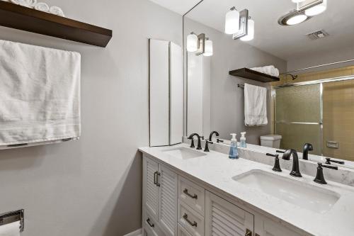 a bathroom with a sink and a mirror at Beautiful home by Medical ctr, Rice, Museums in Houston