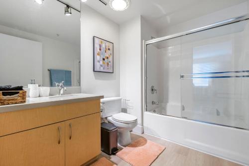 a bathroom with a shower and a toilet and a sink at 12 Best Location Cozy Apartment in Los Angeles