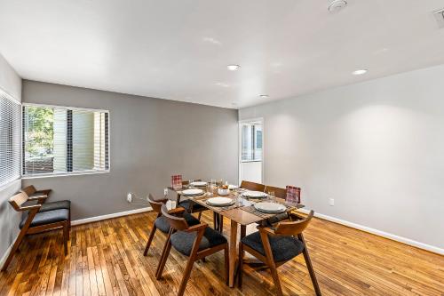 a dining room with a table and chairs at Beautiful home by Medical ctr, Rice, Museums in Houston