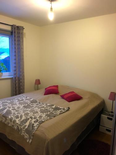 a bedroom with a bed and a window at Guest house Norrköping in Norrköping
