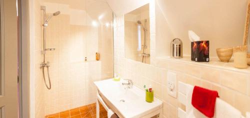 a white bathroom with a sink and a shower at Water Mill - Private Lake - Fiber Wifi - Burgundy in Rix