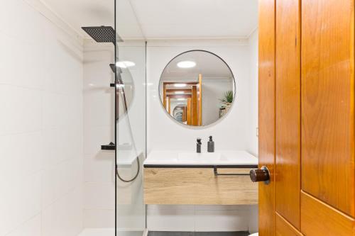 a bathroom with a sink and a mirror at Resort Apartment Cabanas de Tavira in Tavira