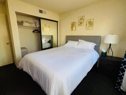 a large white bed in a hotel room at 1Bd Prime Westwood Location One Block from UCLA in Los Angeles