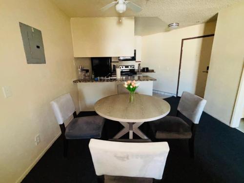 a room with a table and chairs and a kitchen at 1Bd Prime Westwood Location One Block from UCLA in Los Angeles