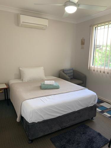 a bedroom with a bed with a pillow on it at Grace Guest Rooms in Roma