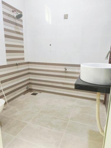 a bathroom with a sink and a tub in a room at Casa Ariana Machang 3B3R in Macang