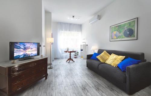 a living room with a couch and a flat screen tv at A Casa di Renata in Cosenza