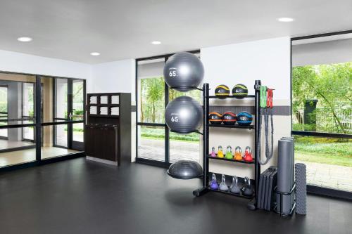 a gym room with a fitness ball rack with balls at Courtyard Greenville-Spartanburg Airport in Greenville