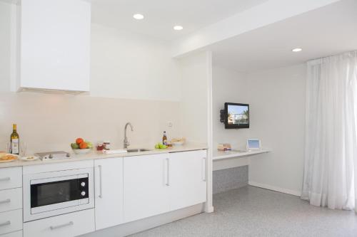 Kuchyň nebo kuchyňský kout v ubytování Apartamentos Turísticos Mix BR AT2179